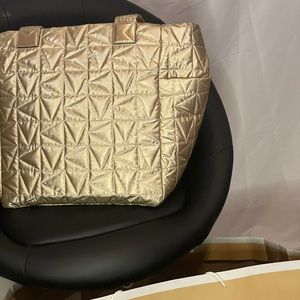 Michael Kors gold handbag